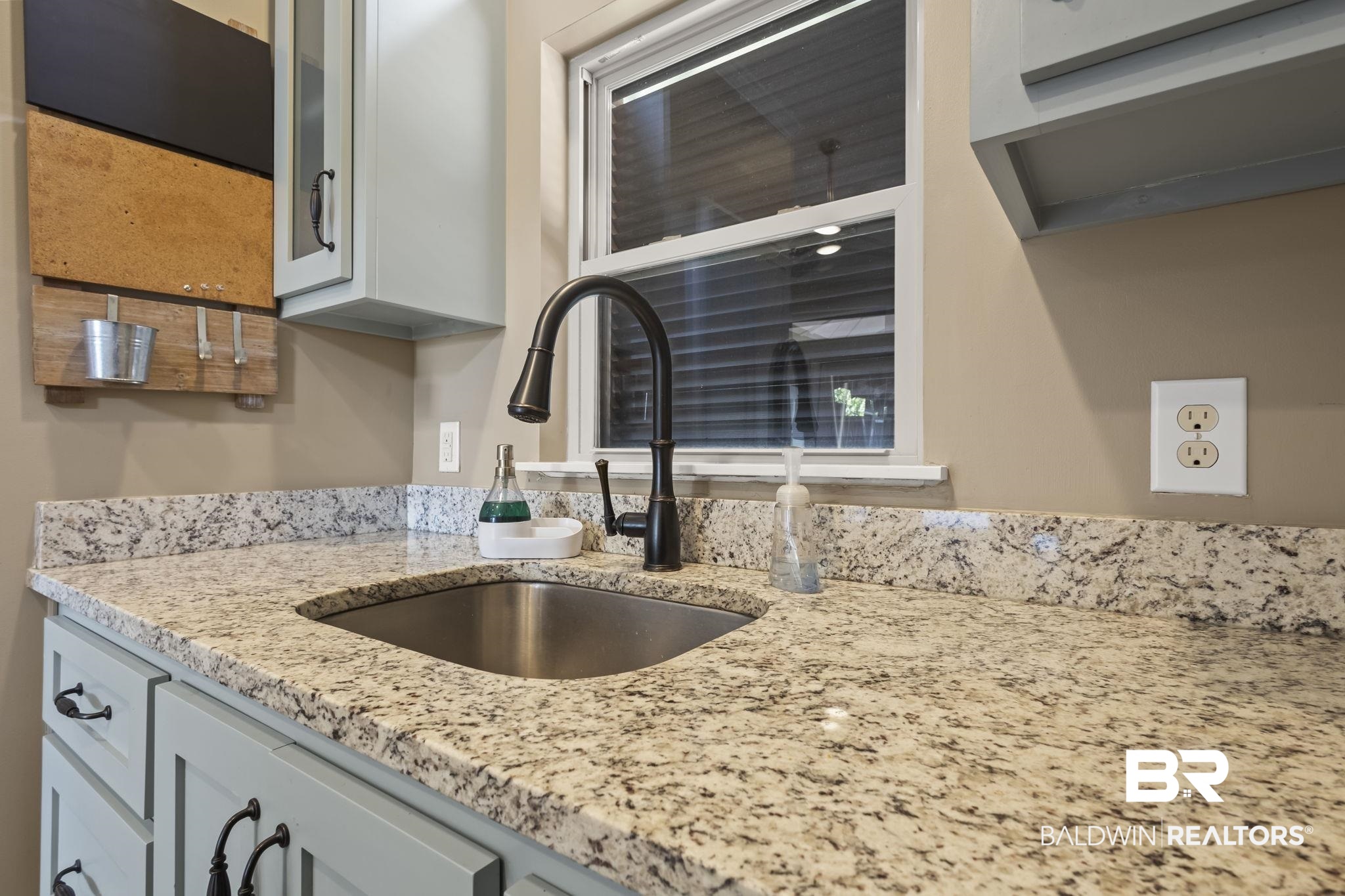 212 Magnifico Drive Foley, AL 36535 - Photo 28 of 50 Kitchen featuring light stone countertops and sink
