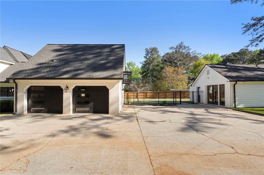 403 Rockbridge Road Southwest Lilburn, GA 30047 - Photo 63 of 77 a view of a house with a outdoor space