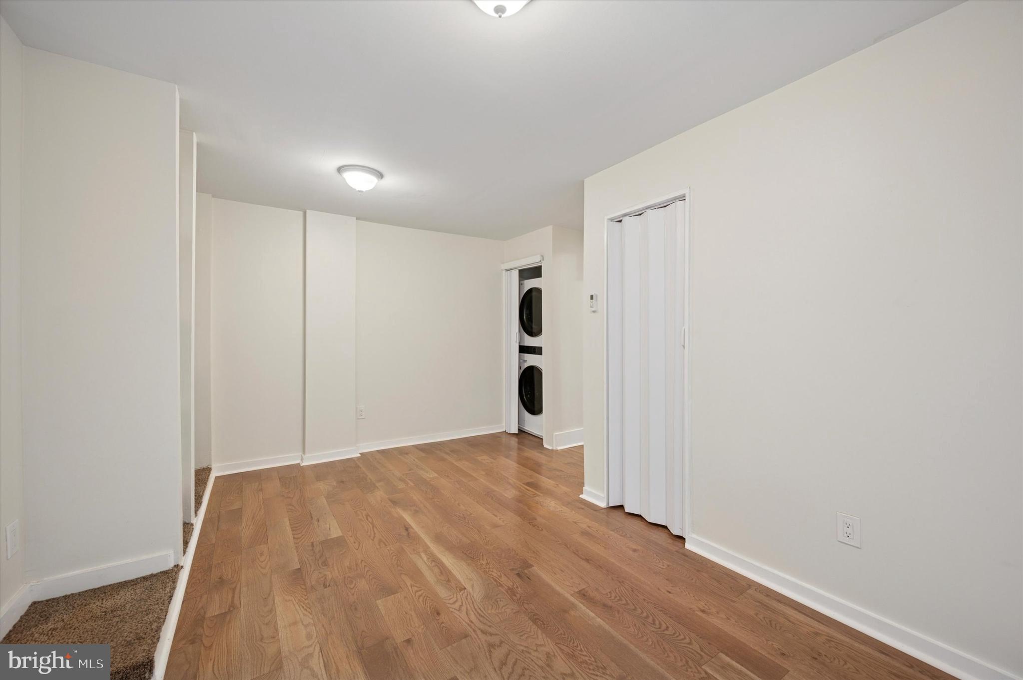 237 Roxborough Avenue, Unit 2 Philadelphia, PA 19128 - Photo 12 of 19 a view of a big room with wooden floor and entryway