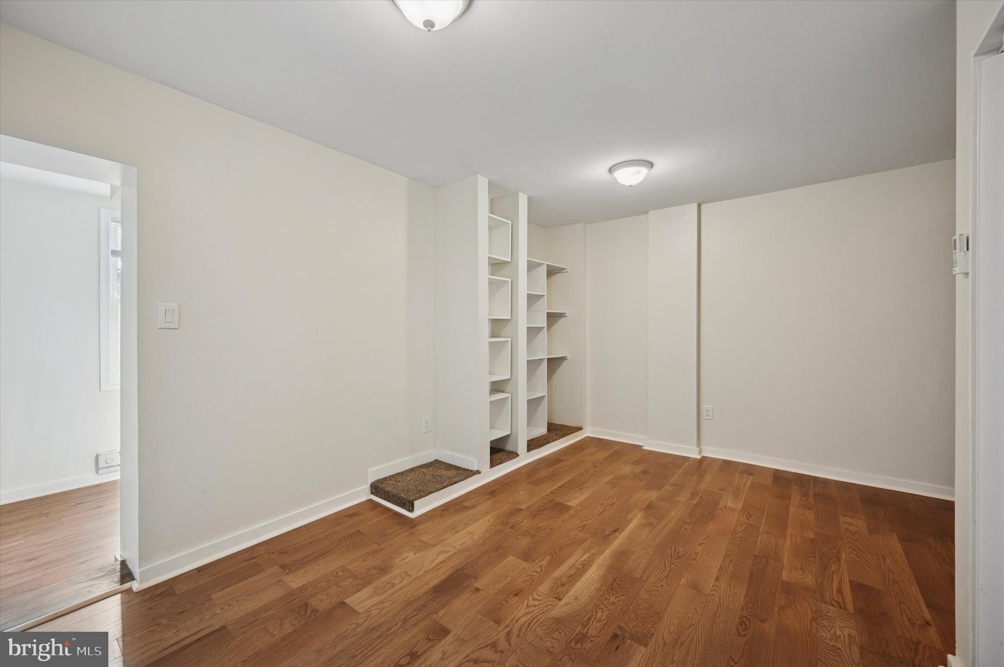 237 Roxborough Avenue, Unit 2 Philadelphia, PA 19128 - Photo 13 of 19 a view of an empty room with wooden floor