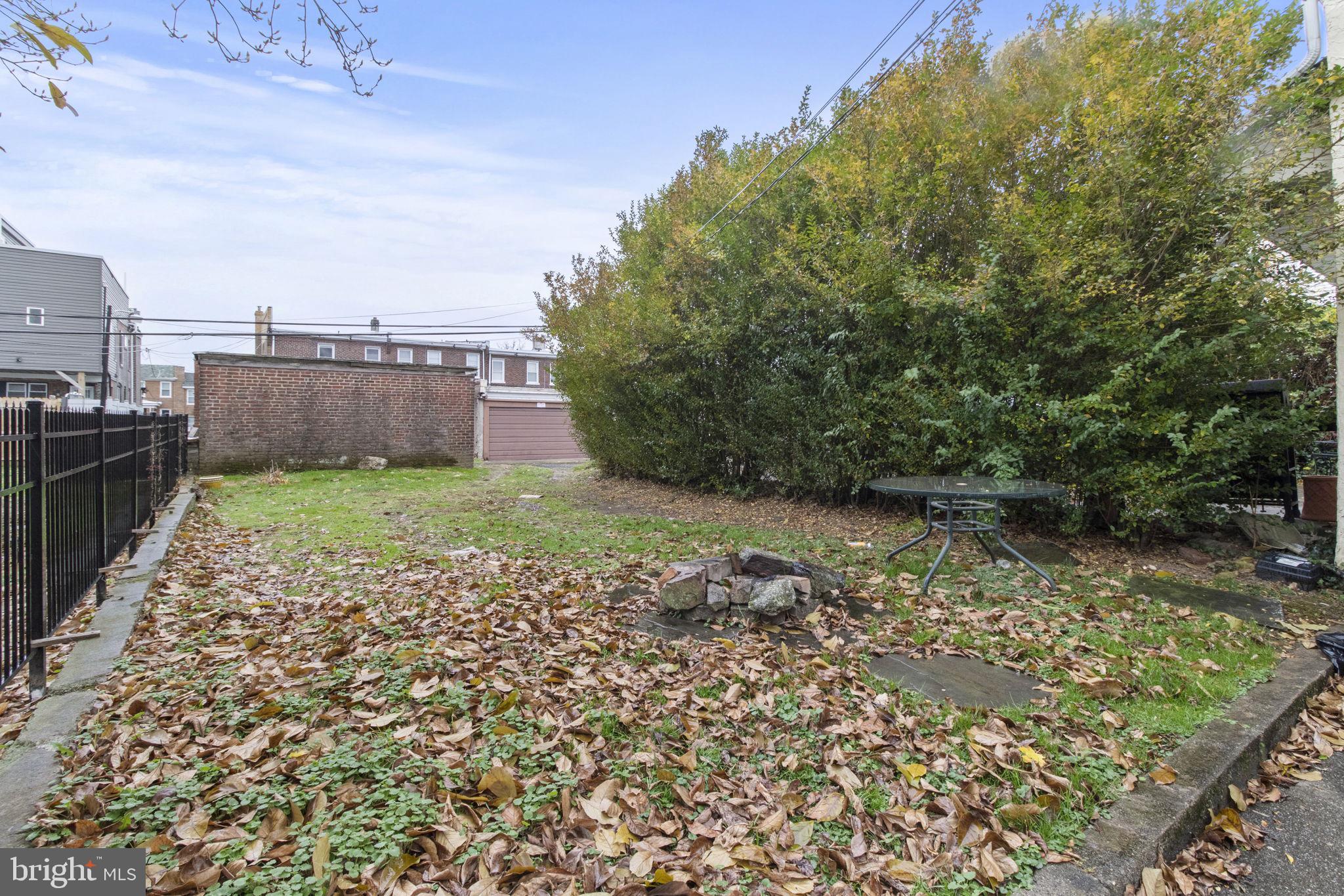 237 Roxborough Avenue, Unit 2 Philadelphia, PA 19128 - Photo 18 of 19 a view of a backyard with large trees