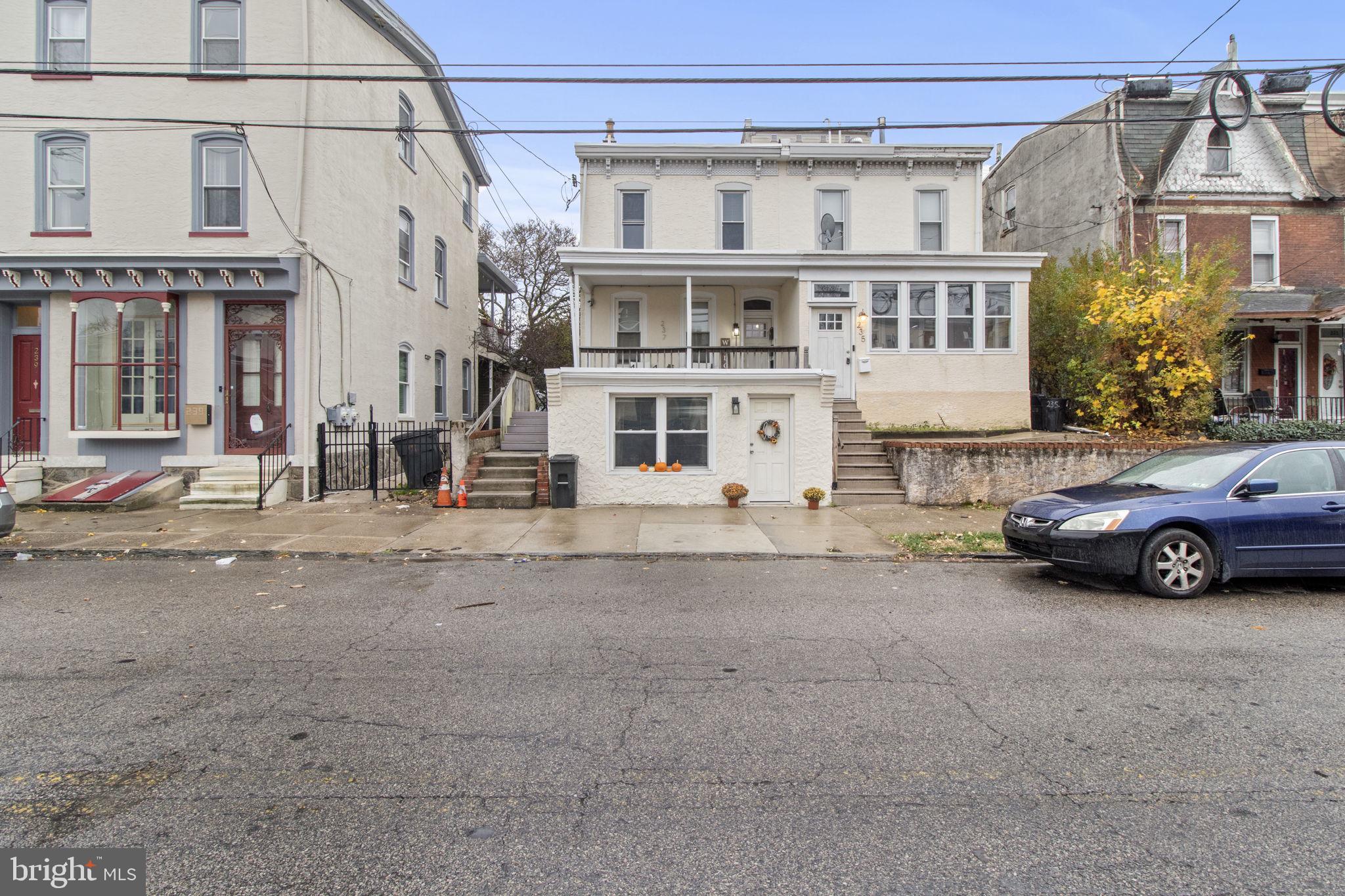 237 Roxborough Avenue, Unit 2 Philadelphia, PA 19128 - Photo 19 of 19 a view of a car is parked in front of a house