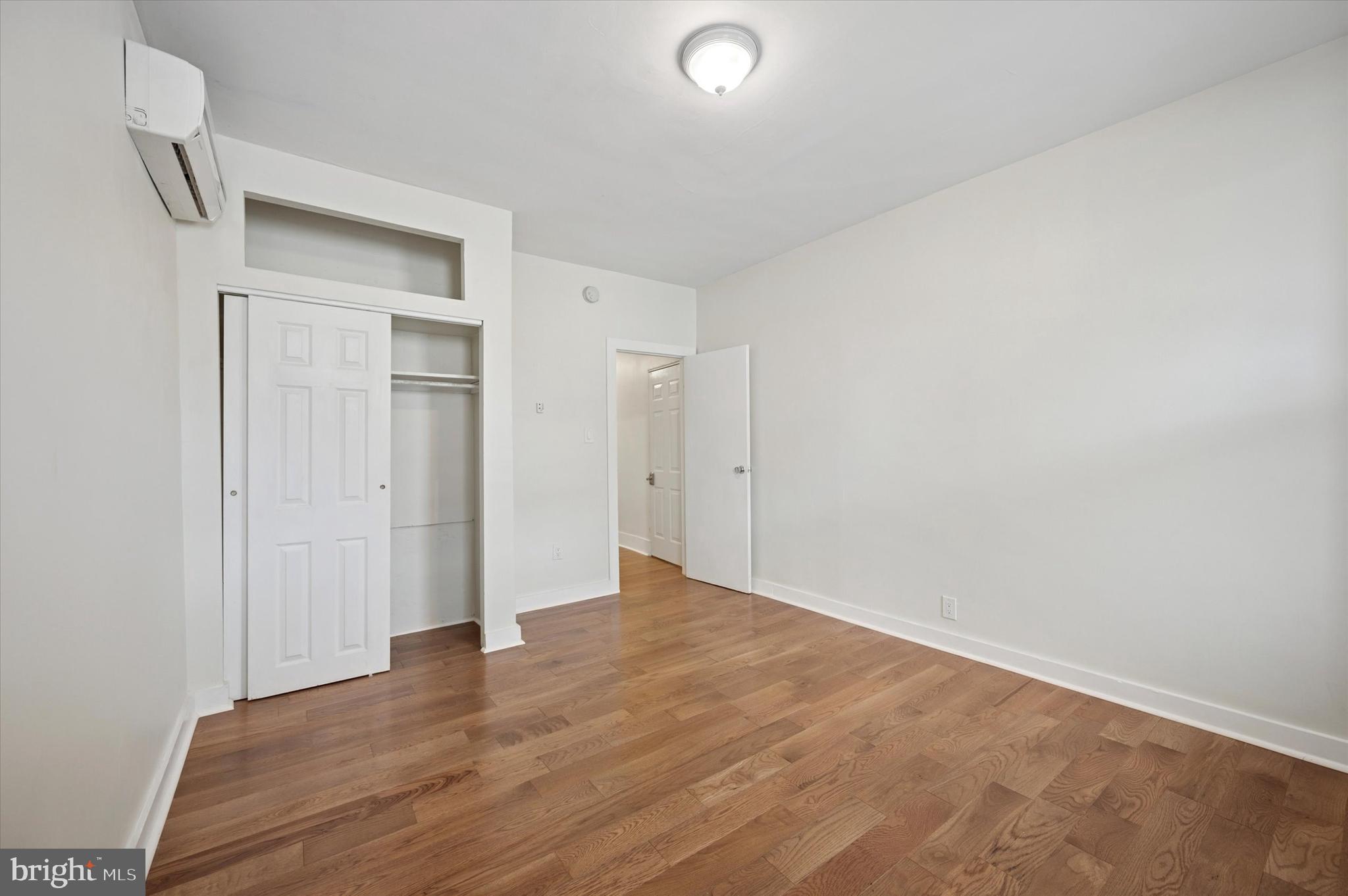 237 Roxborough Avenue, Unit 2 Philadelphia, PA 19128 - Photo 4 of 19 a view of an empty room with wooden floor