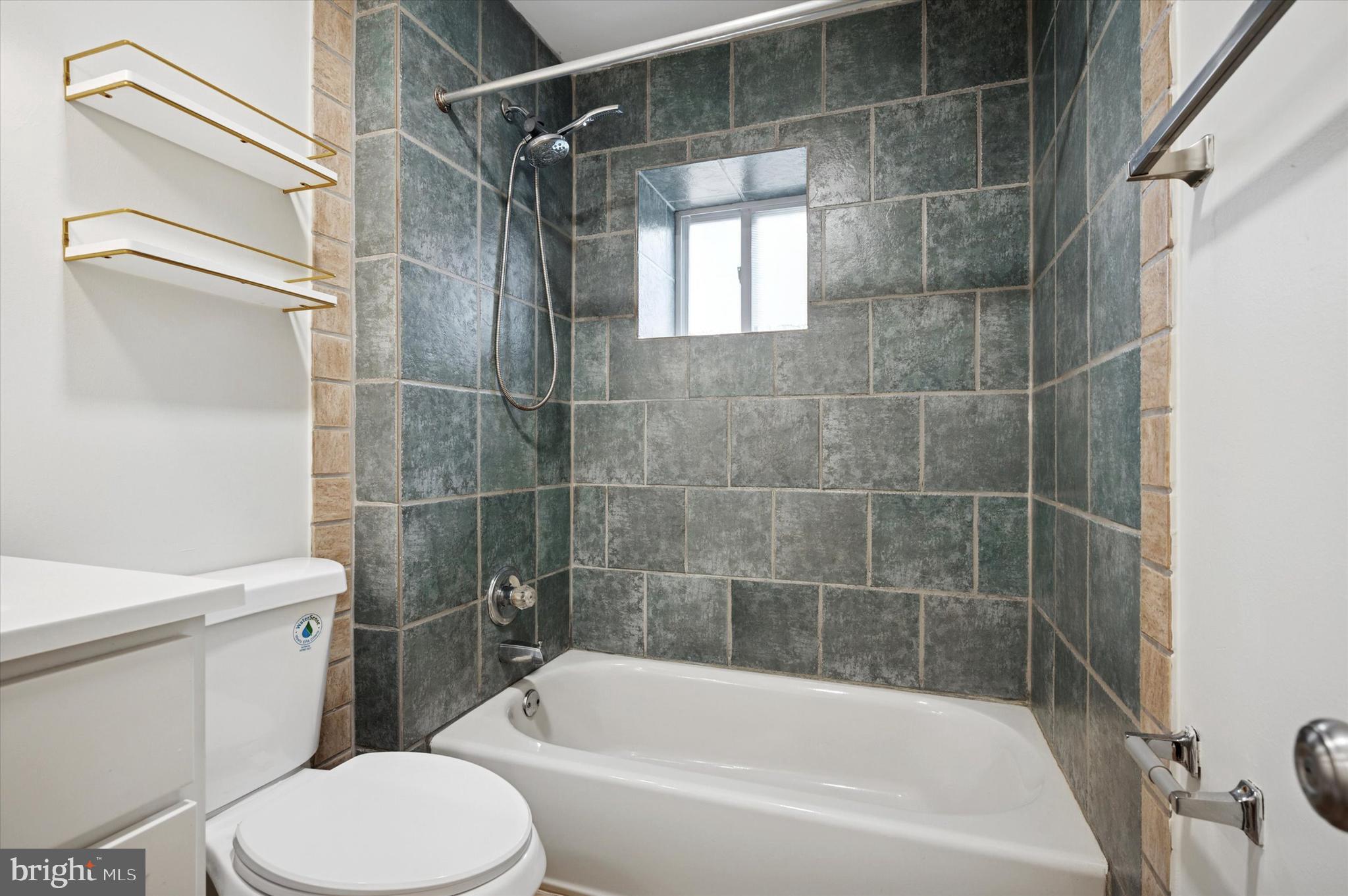237 Roxborough Avenue, Unit 2 Philadelphia, PA 19128 - Photo 6 of 19 a bathroom with a bathtub and toilet