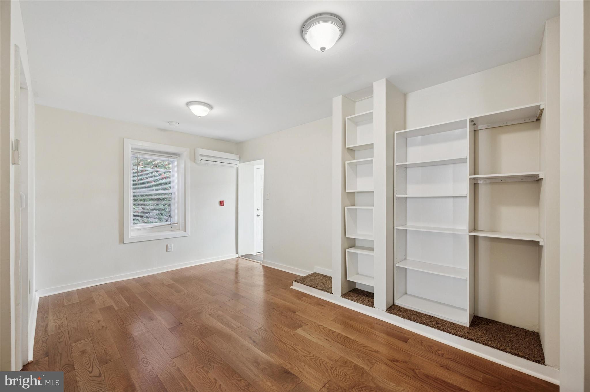 237 Roxborough Avenue, Unit 2 Philadelphia, PA 19128 - Photo 9 of 19 a view of an empty room with a window