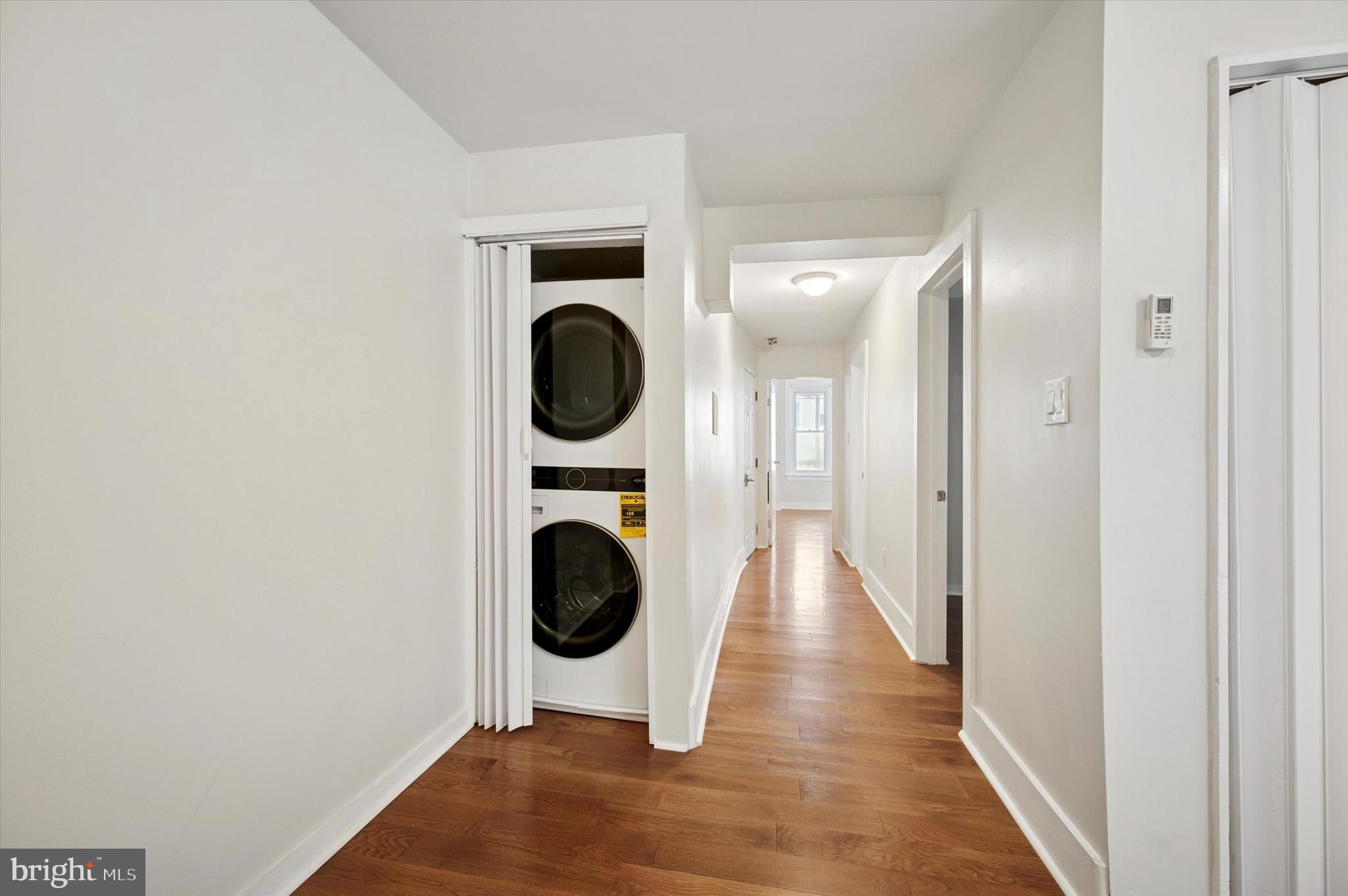 237 Roxborough Avenue, Unit 2 Philadelphia, PA 19128 - Photo 10 of 19 a view of a hallway with washer and dryer