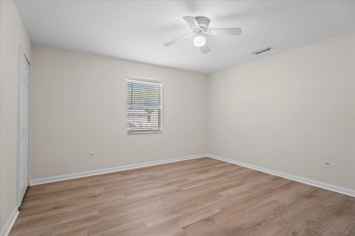 4420 Carter Road, Unit 33 St. Augustine, FL 32086 - Photo 13 of 20 wooden floor in an empty room with a window
