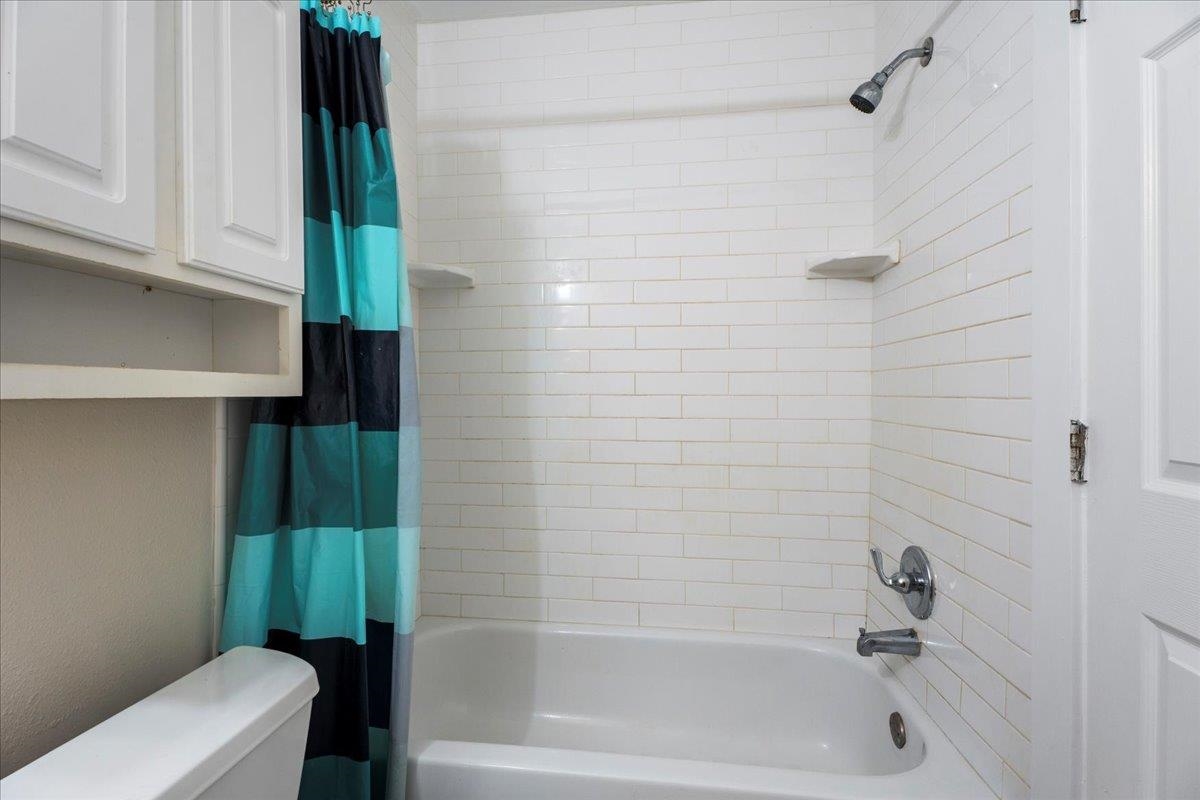 4420 Carter Road, Unit 33 St. Augustine, FL 32086 - Photo 16 of 20 a bathroom with a shower and a toilet