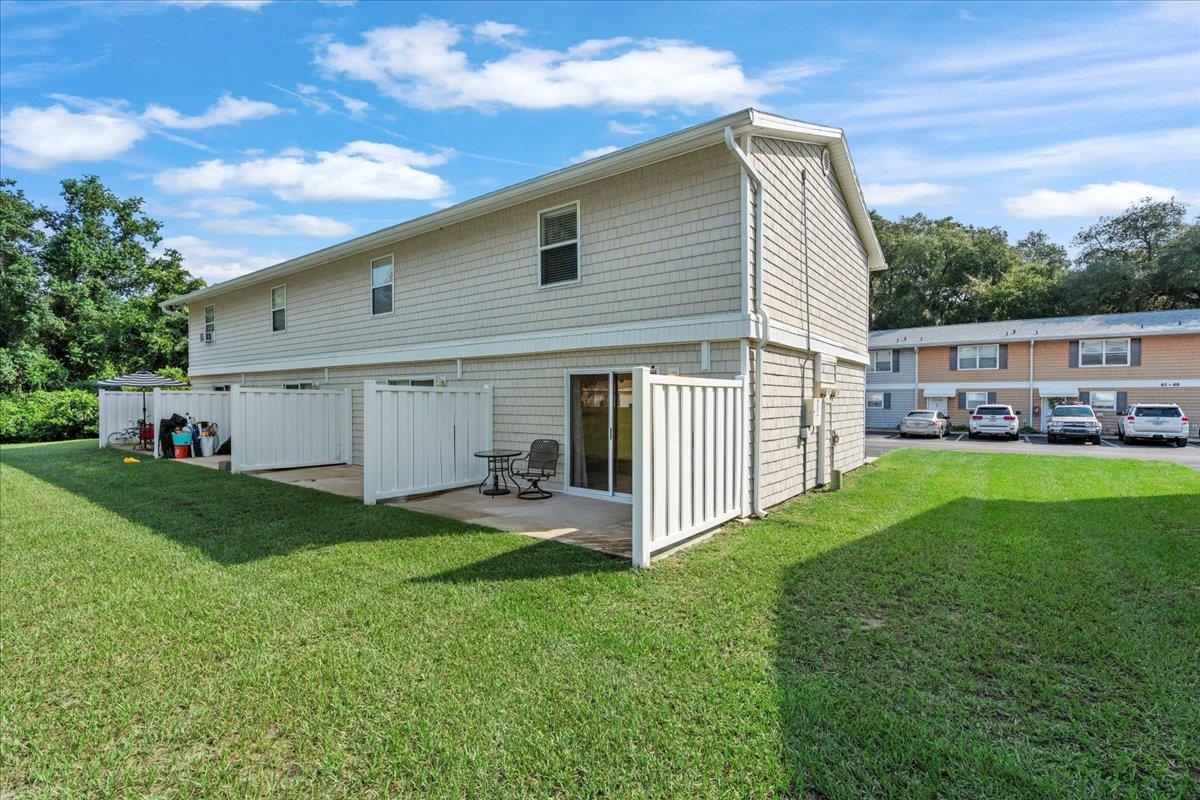 4420 Carter Road, Unit 33 St. Augustine, FL 32086 - Photo 19 of 20 a view of a house with backyard and porch