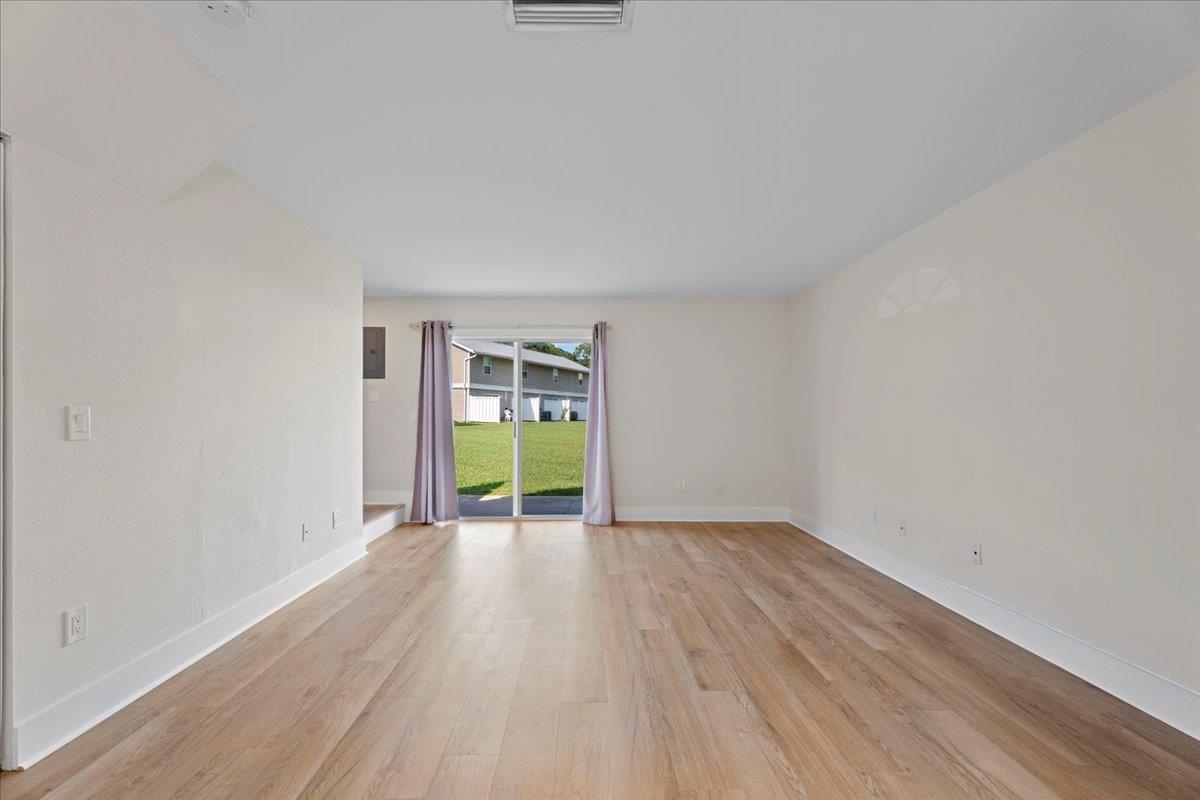 4420 Carter Road, Unit 33 St. Augustine, FL 32086 - Photo 2 of 20 a view of a room with wooden floor and a sink