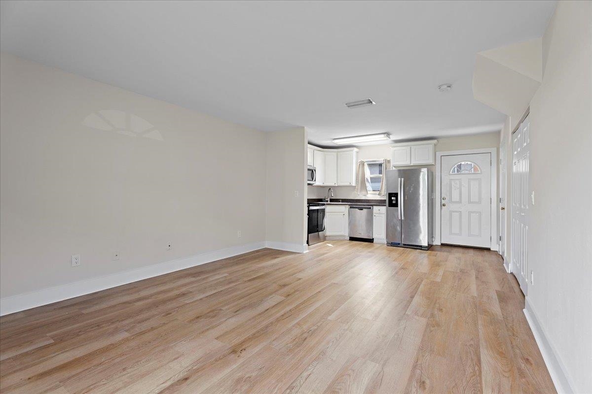 4420 Carter Road, Unit 33 St. Augustine, FL 32086 - Photo 9 of 20 a view of a kitchen with wooden floor