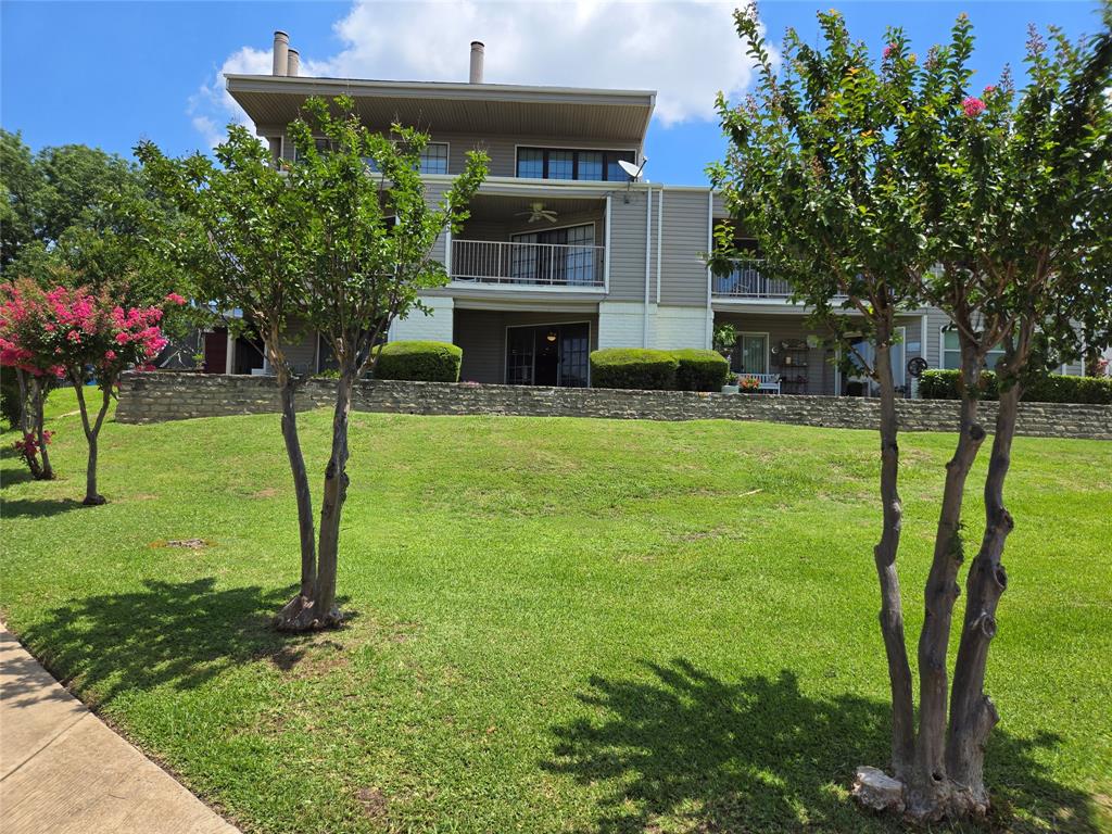 428 Yacht Club Drive, Unit B Rockwall, TX 75032 - Photo 11 of 11 a front view of a house with a yard