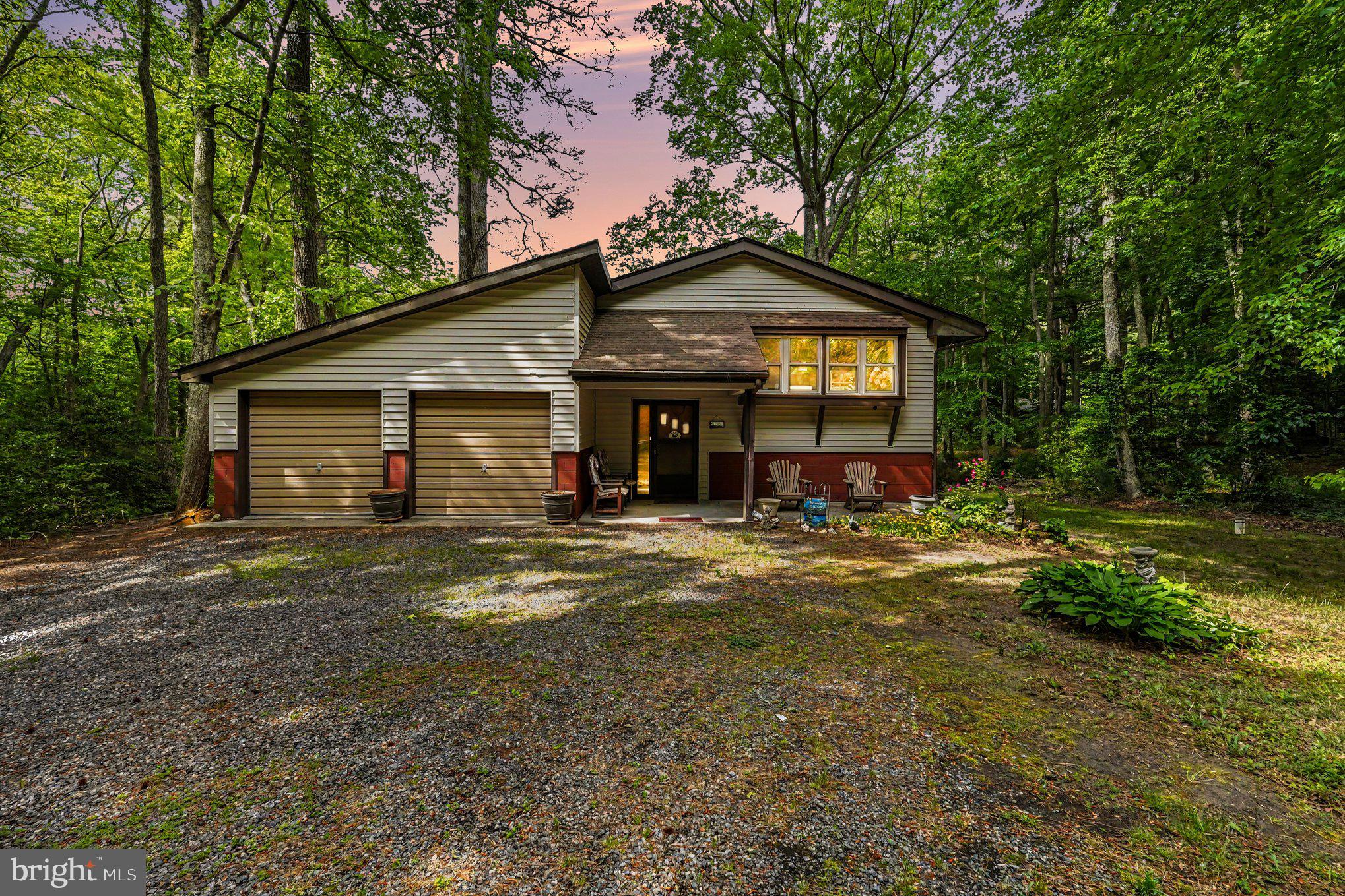 Welcome to this waterfront home on wooded lot