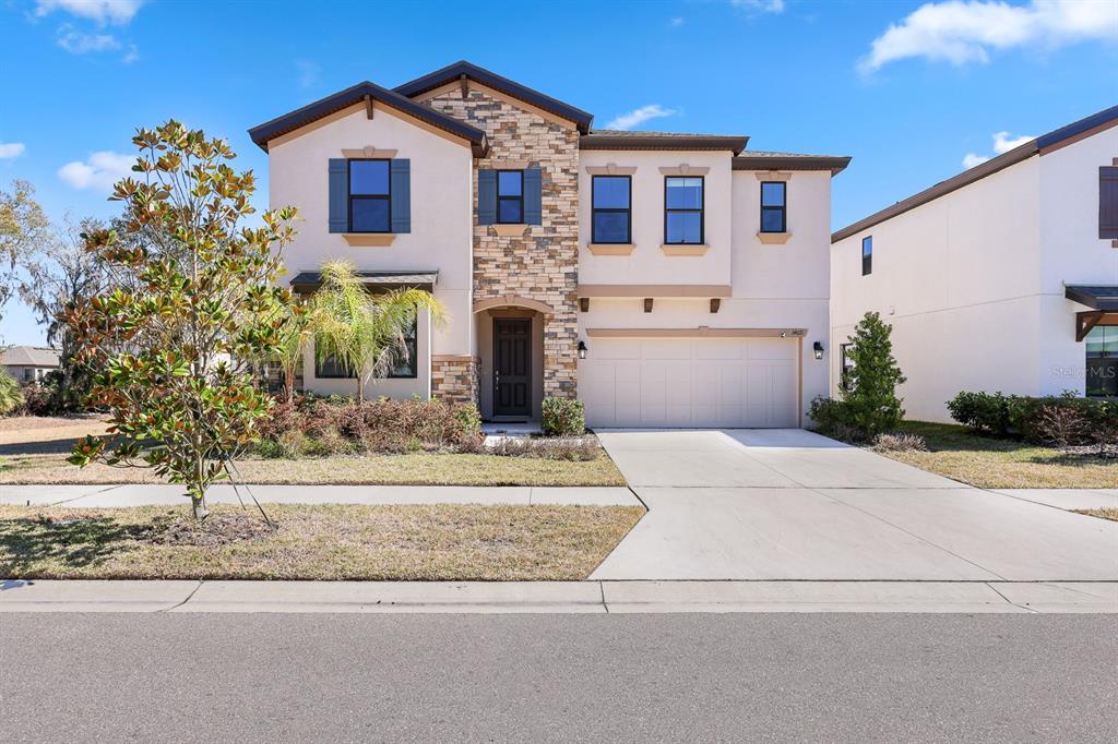 14671 Horse Trot Road Lithia, FL 33547 - Photo 33 of 40 a front view of a house with a yard