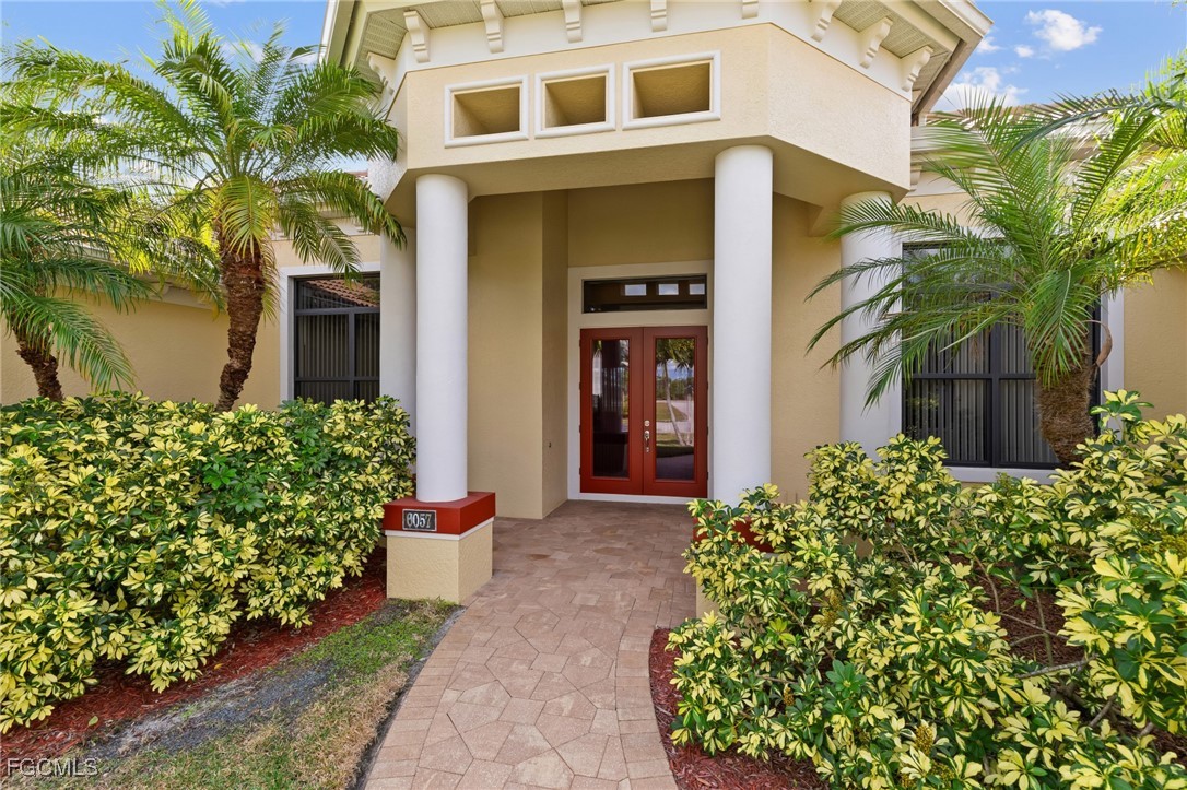 6057 Calusa Rdg Trail Bokeelia, FL 33922 - Photo 3 of 45 a front view of a house with garden