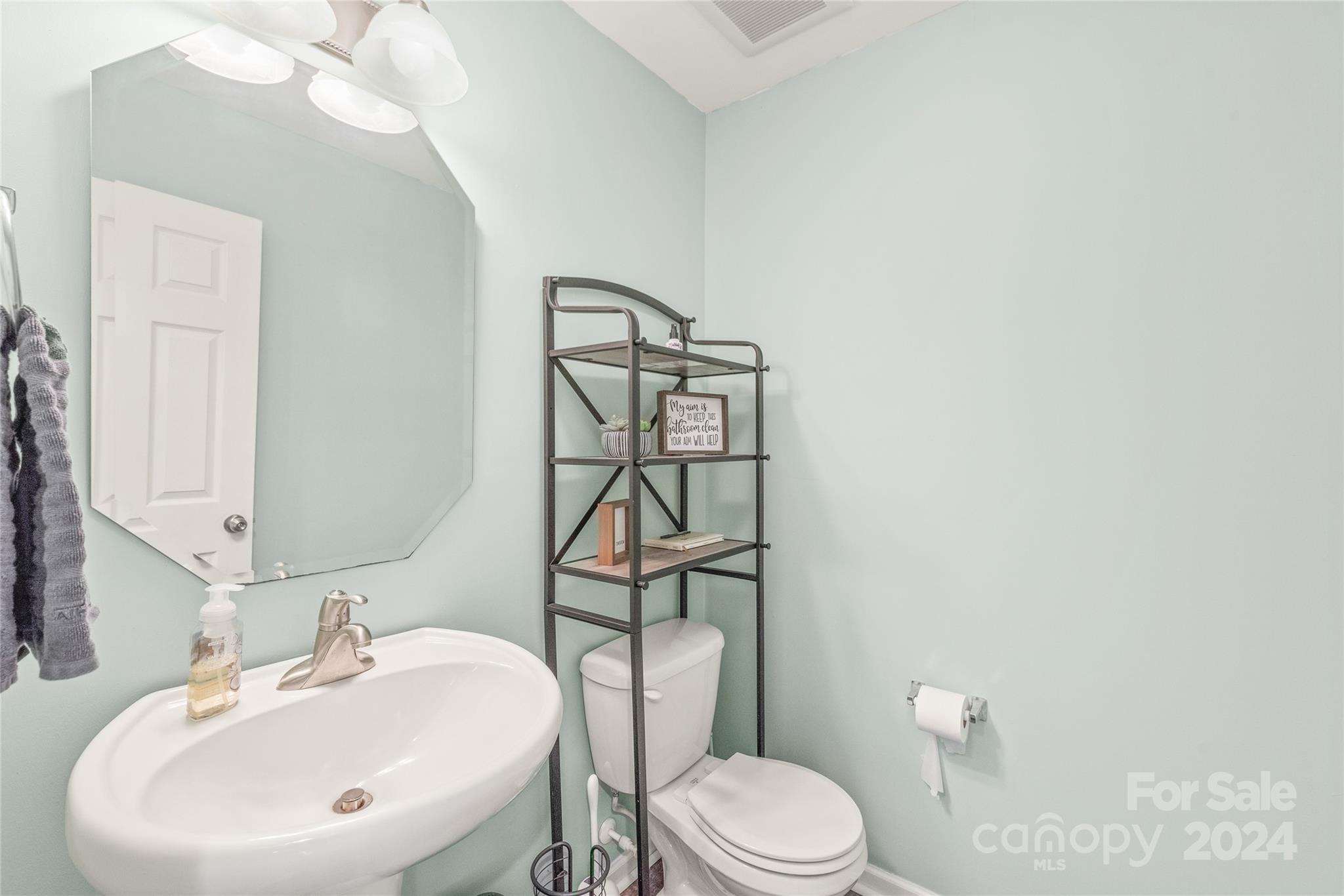 11616 Mud Drive Midland, NC 28107 - Photo 11 of 29 a bathroom with a sink mirror vanity and toilet