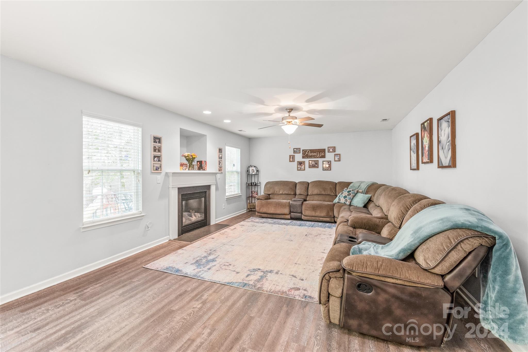 11616 Mud Drive Midland, NC 28107 - Photo 12 of 29 a living room with furniture and a fireplace
