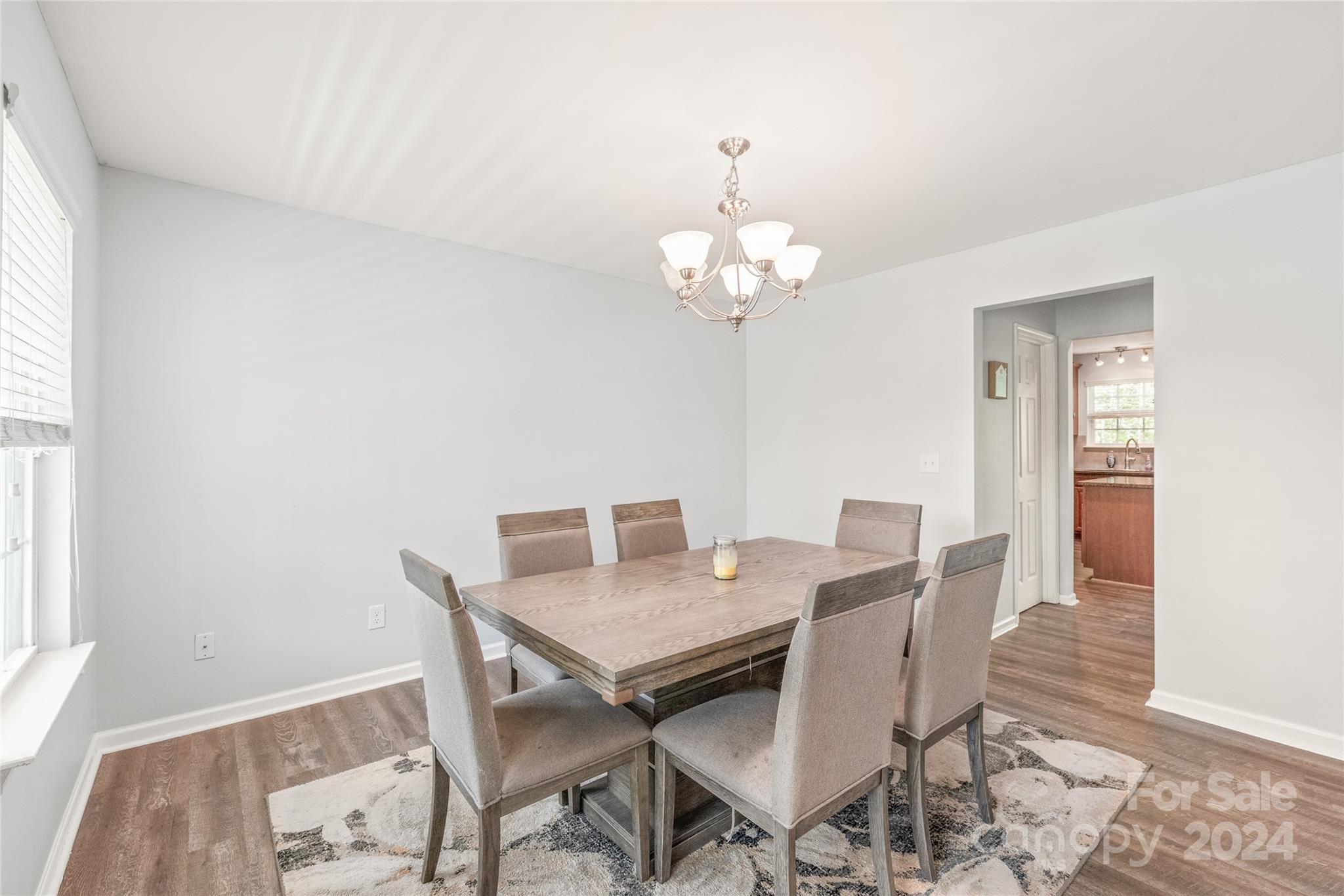 11616 Mud Drive Midland, NC 28107 - Photo 4 of 29 a view of a dining room with furniture and wooden floor