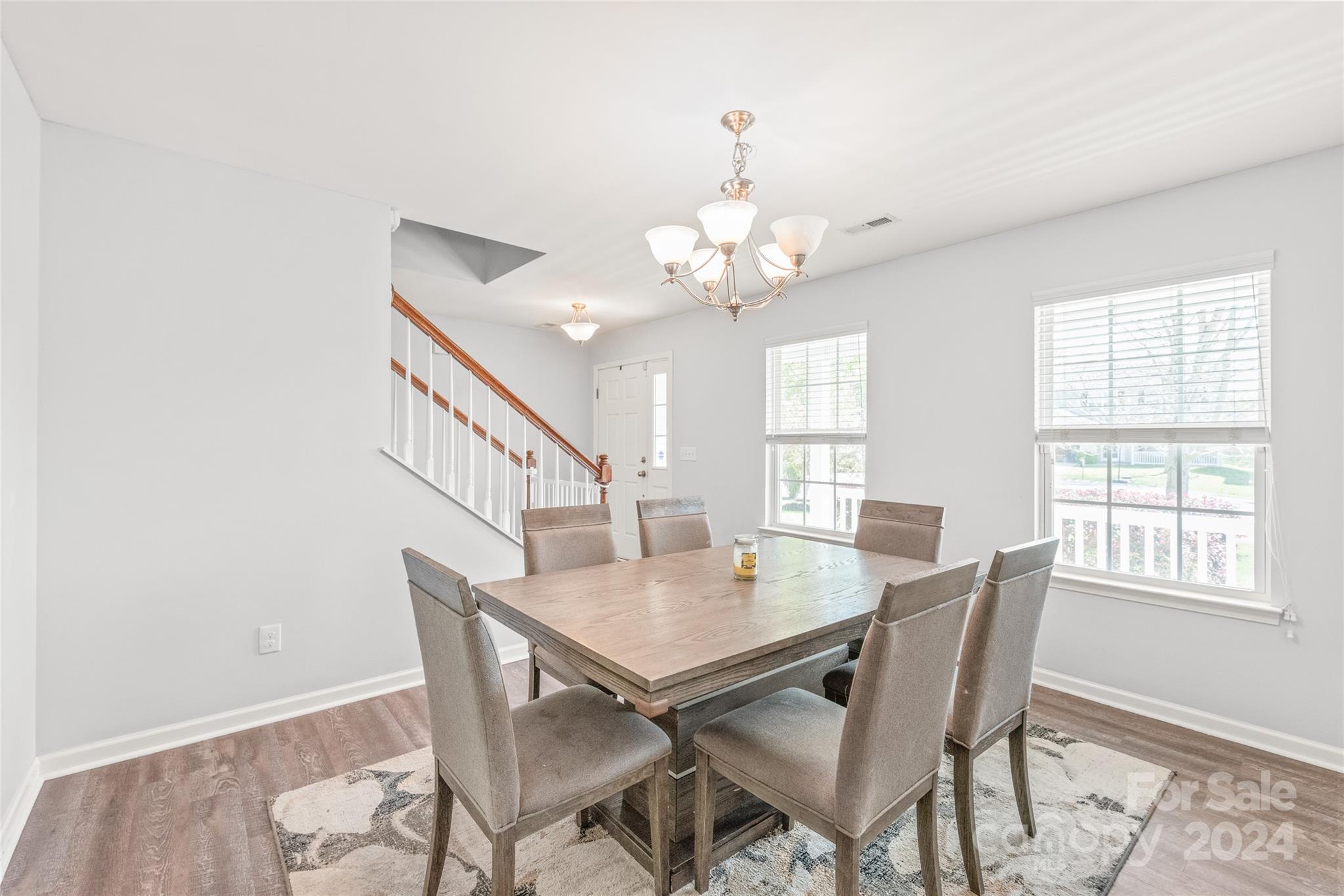 11616 Mud Drive Midland, NC 28107 - Photo 5 of 29 a view of a dining room with furniture window and wooden floor