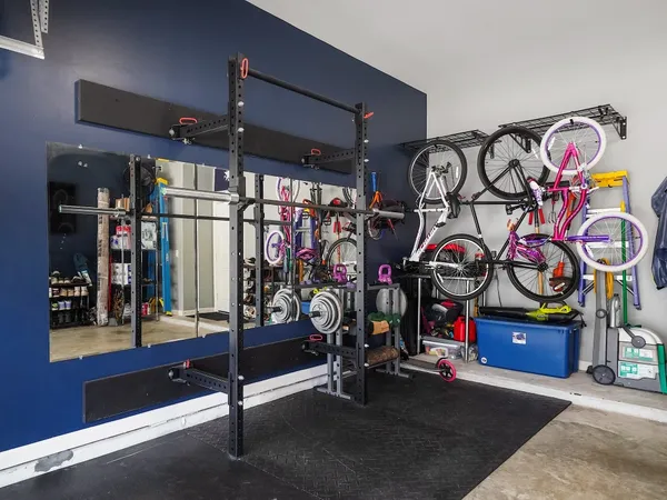 a bathroom with a tub sink shower and mirror