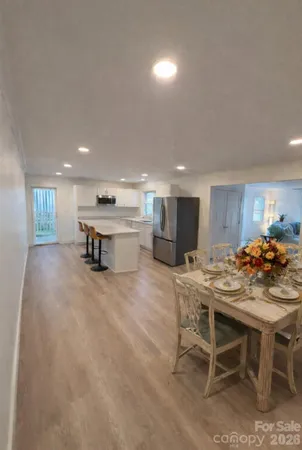 a kitchen with a table and chairs in it