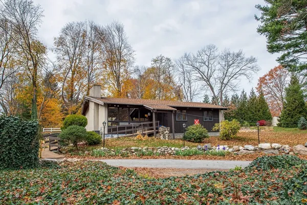 a front view of a house with garden