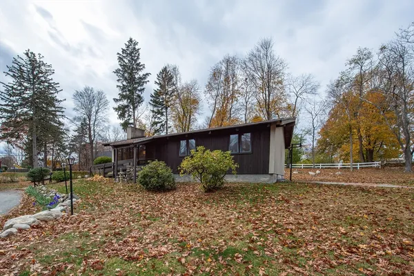 a backyard of a house with lots of green space