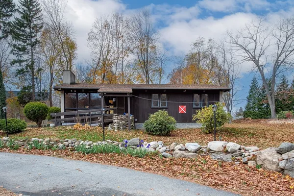 a front view of house with yard and seating area