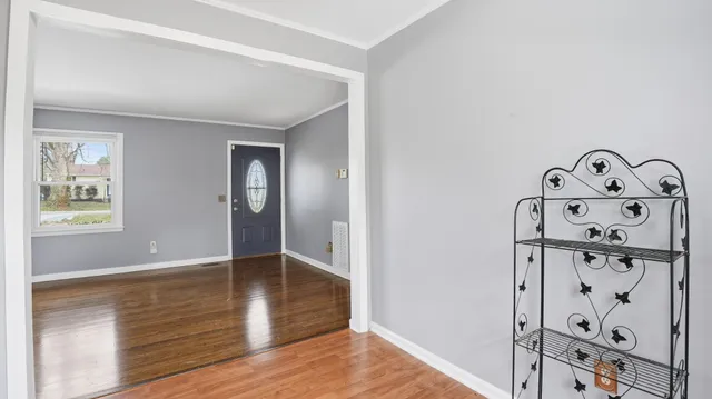 a view of an entryway with wooden floor
