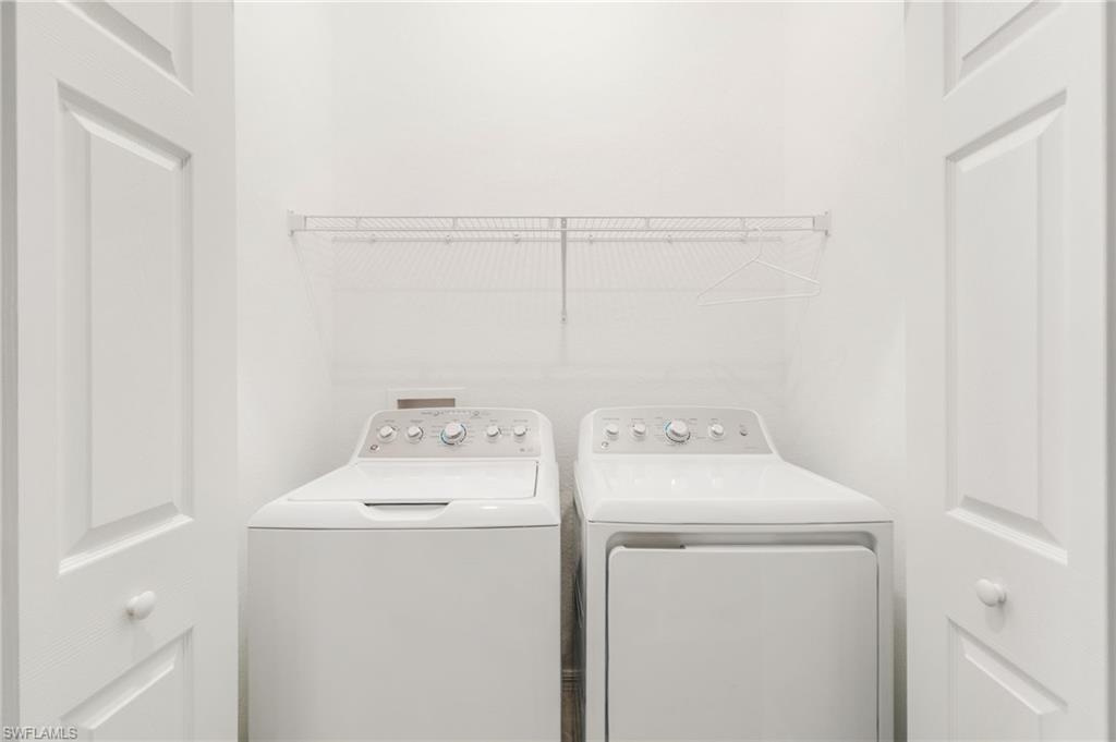 2767 Blossom Way Naples, FL 34120 - Photo 22 of 38 a utility room with dryer and washer