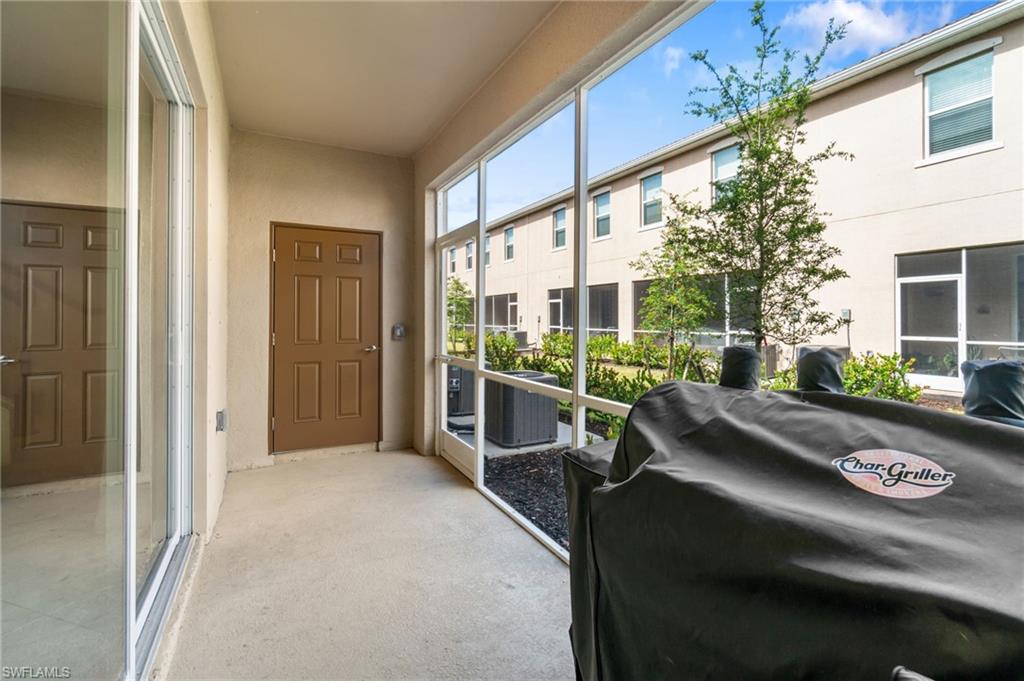 2767 Blossom Way Naples, FL 34120 - Photo 25 of 38 a view of a balcony with chairs