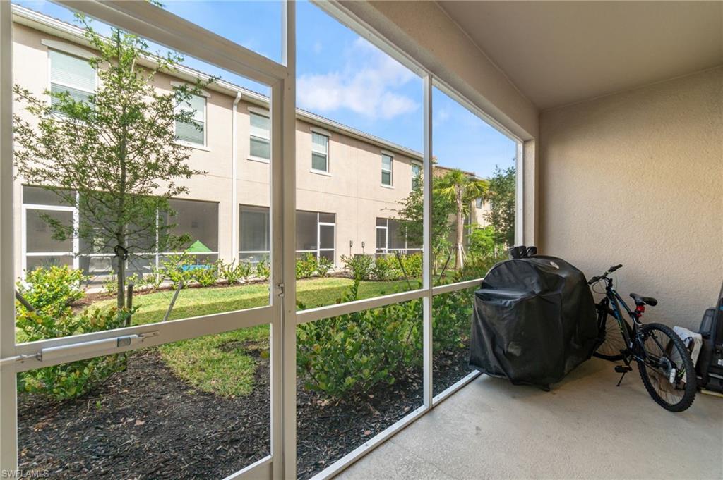 2767 Blossom Way Naples, FL 34120 - Photo 26 of 38 a view of a porch with furniture and garden
