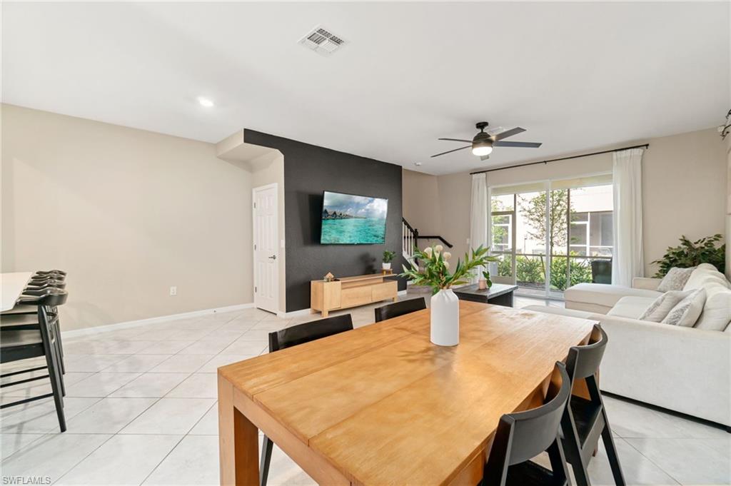 2767 Blossom Way Naples, FL 34120 - Photo 3 of 38 a view of a dining room with furniture