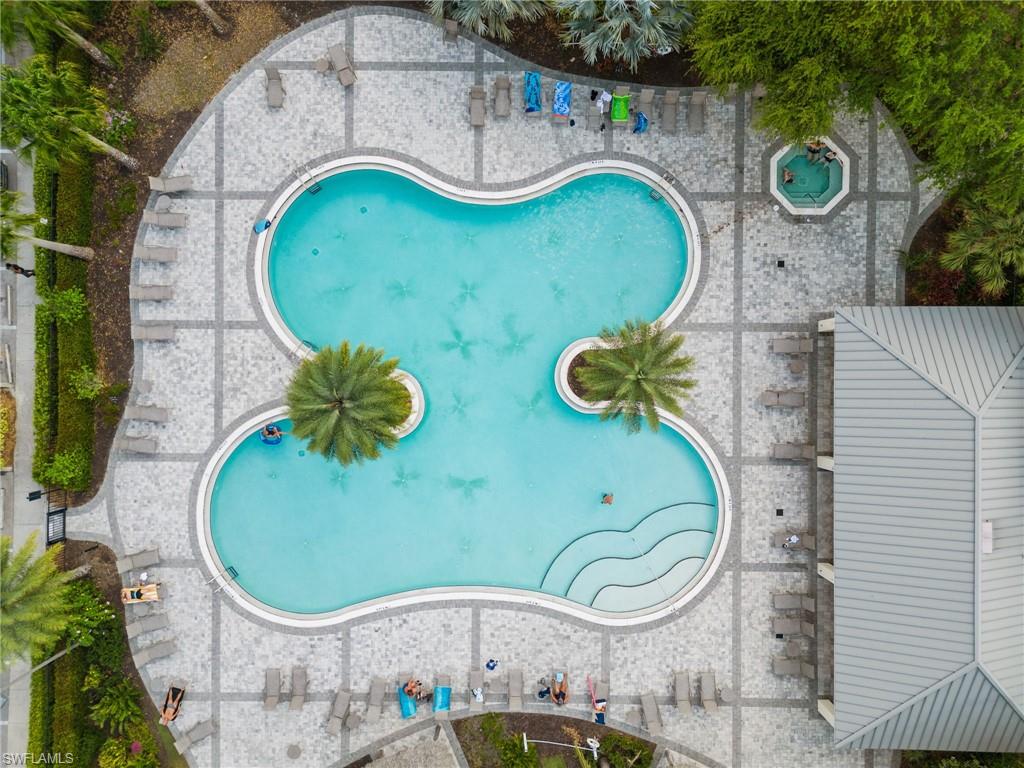 2767 Blossom Way Naples, FL 34120 - Photo 32 of 38 an aerial view of a swimming pool with outdoor seating and yard