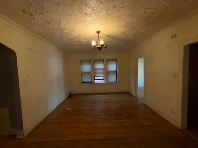a view of a windows and chandelier in a room
