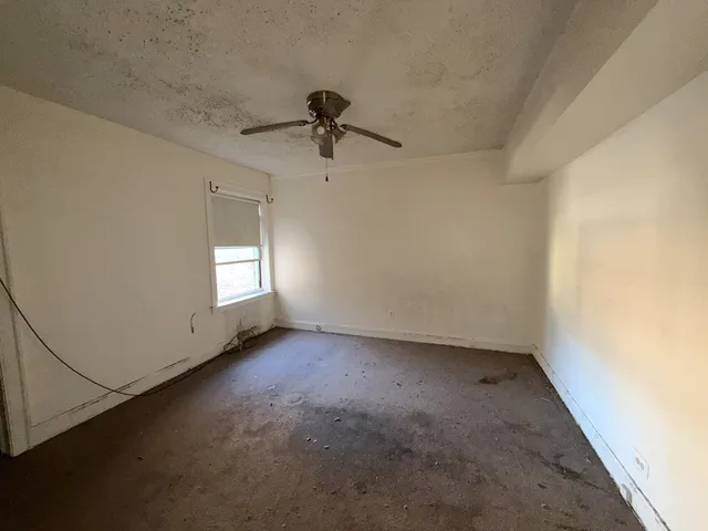 a view of empty room with windows