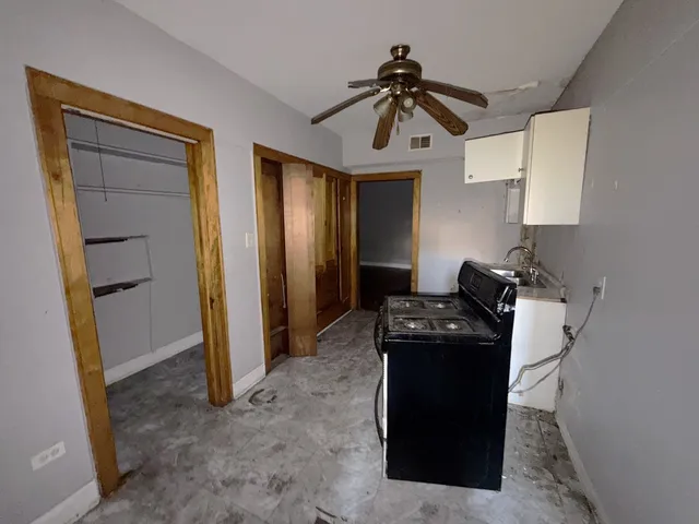 a view of a workspace with furniture