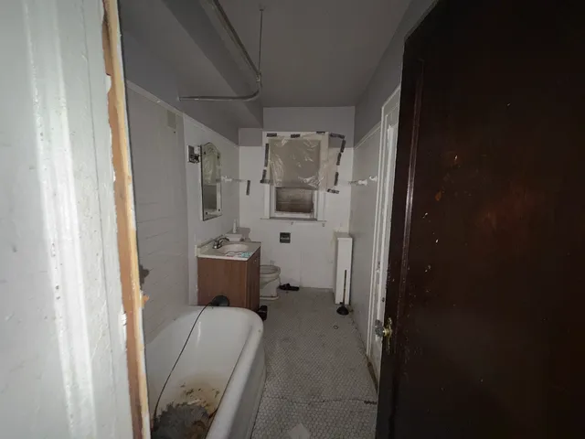 a bathroom with a sink and mirror