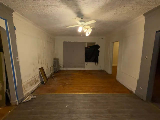 a view of an empty room and window