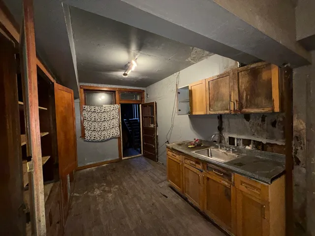 a kitchen with stainless steel appliances granite countertop a stove sink and cabinets