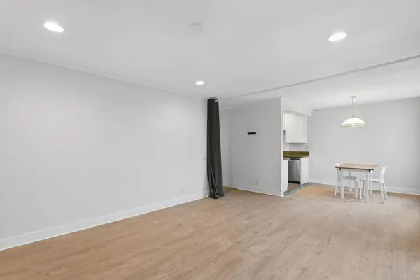 an empty room with furniture and a table