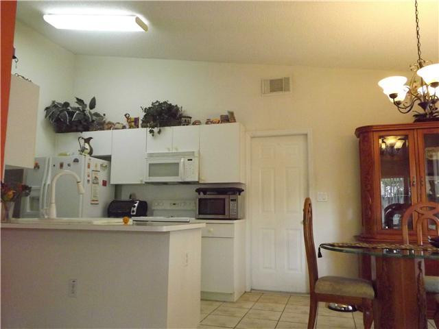 8410 Southwest 157th Court Miami, FL 33193 - Photo 3 of 15 a bathroom with a sink and a mirror