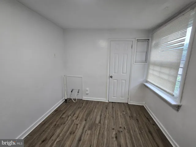 a view of a room with wooden floors and led lights
