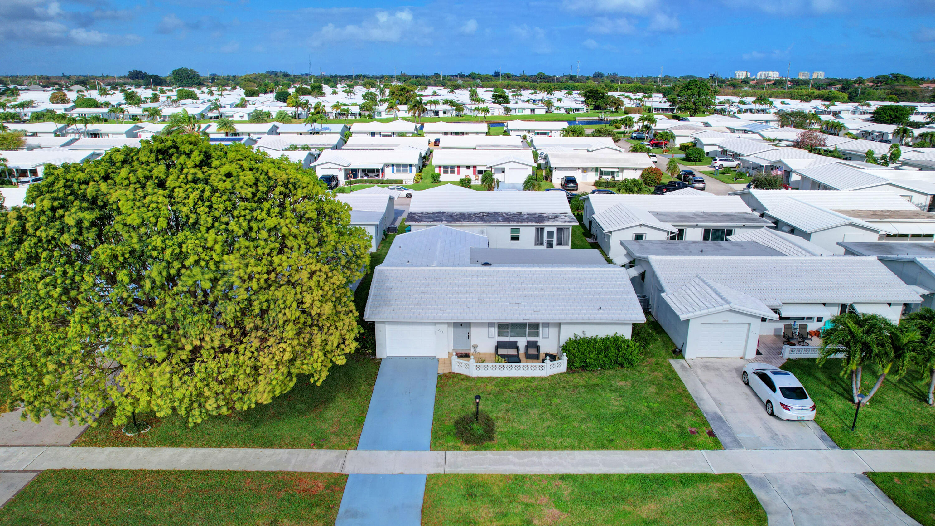 716 Southwest 18th Street Boynton Beach, FL 33426 - Photo 2 of 65 an aerial view of a house with a yard