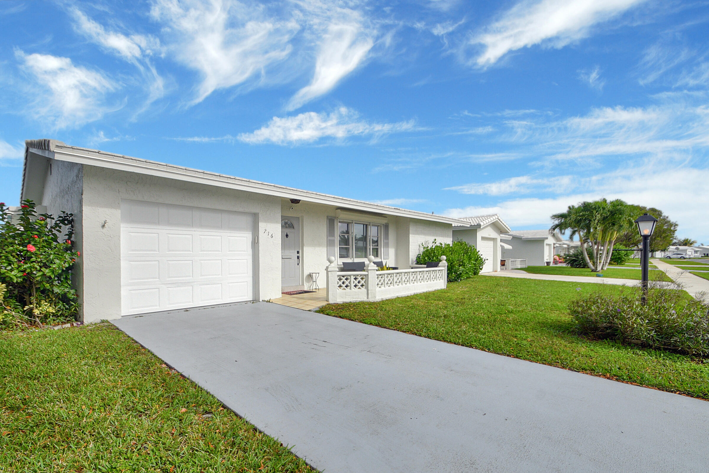 716 Southwest 18th Street Boynton Beach, FL 33426 - Photo 32 of 65 a view of a house with backyard and garden