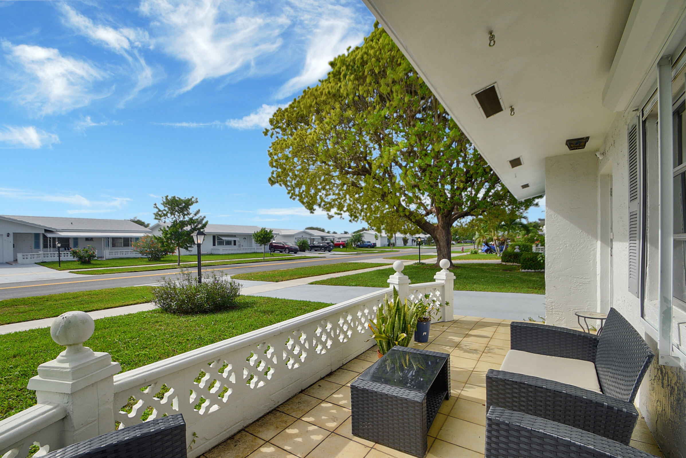 716 Southwest 18th Street Boynton Beach, FL 33426 - Photo 34 of 65 a view of a house with a yard