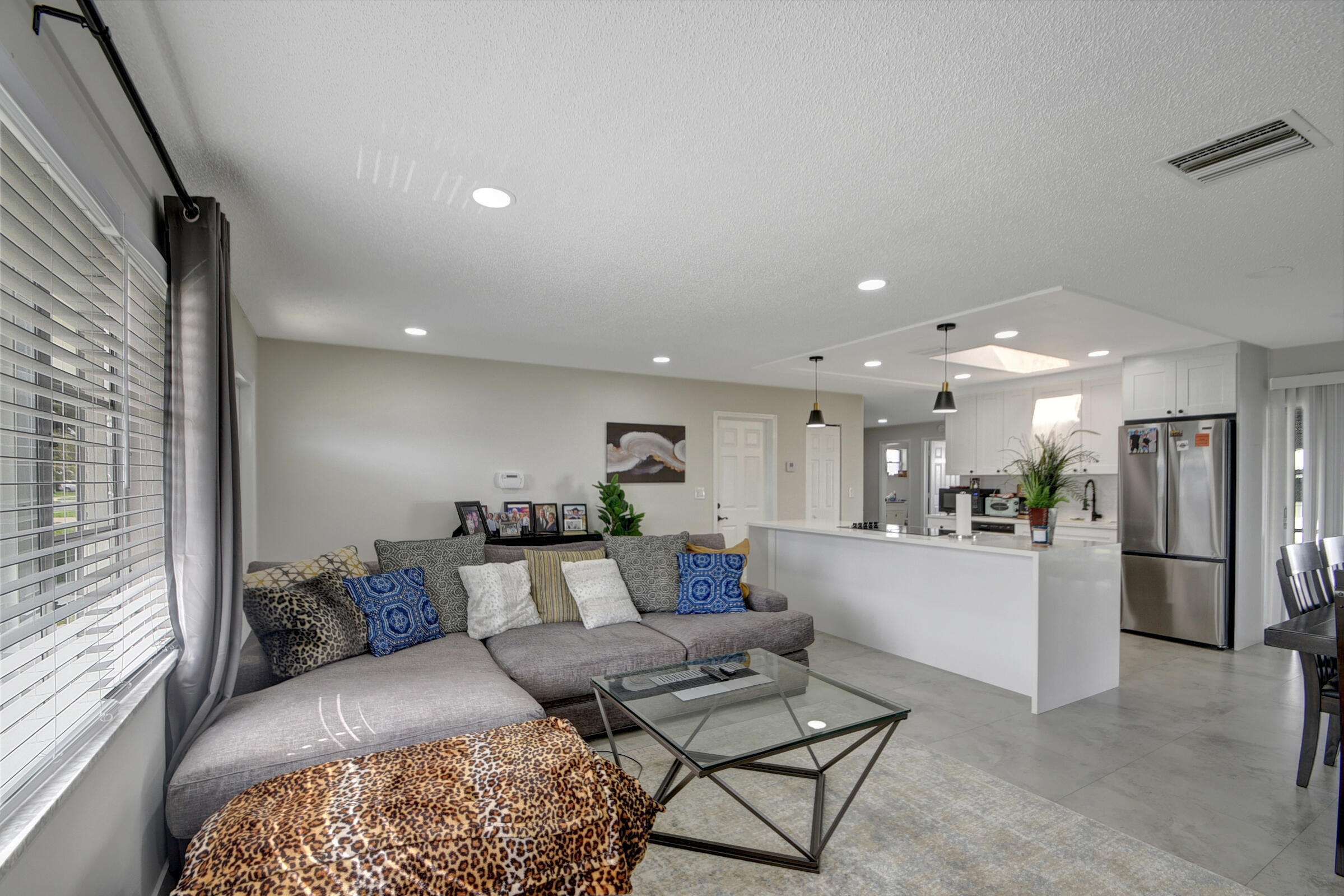 716 Southwest 18th Street Boynton Beach, FL 33426 - Photo 38 of 65 a living room with furniture and a kitchen