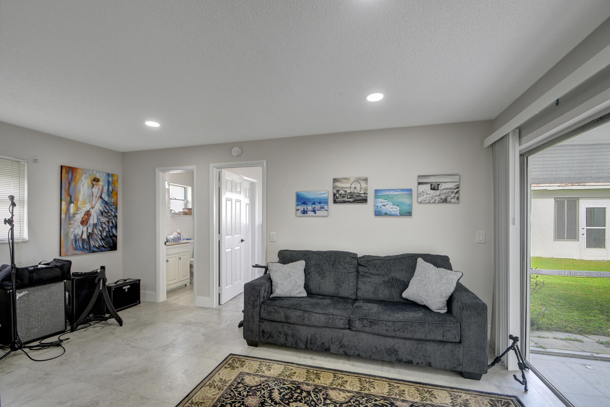 716 Southwest 18th Street Boynton Beach, FL 33426 - Photo 45 of 65 a living room with furniture and a window