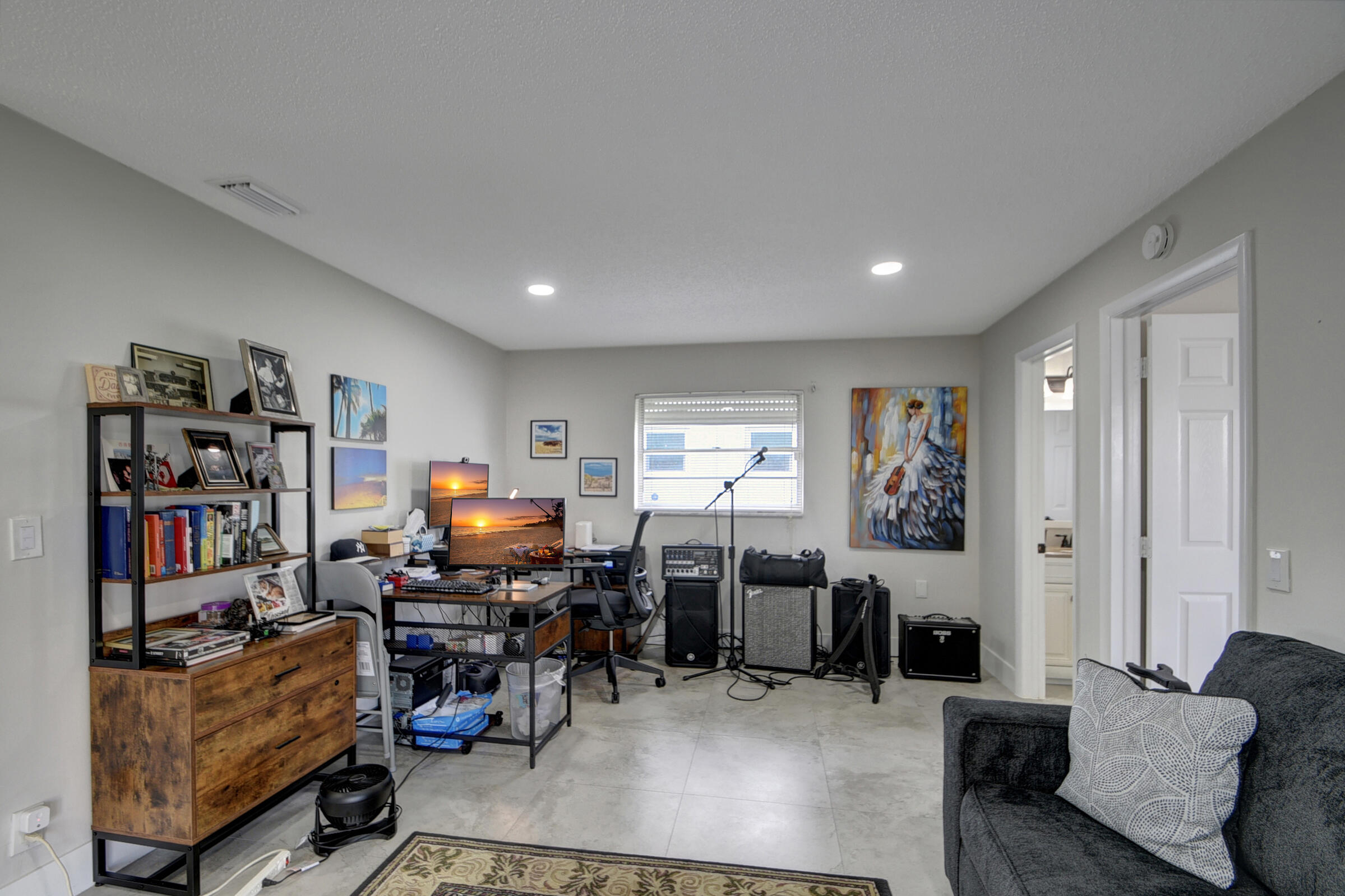 716 Southwest 18th Street Boynton Beach, FL 33426 - Photo 46 of 65 a living room with furniture and a flat screen tv