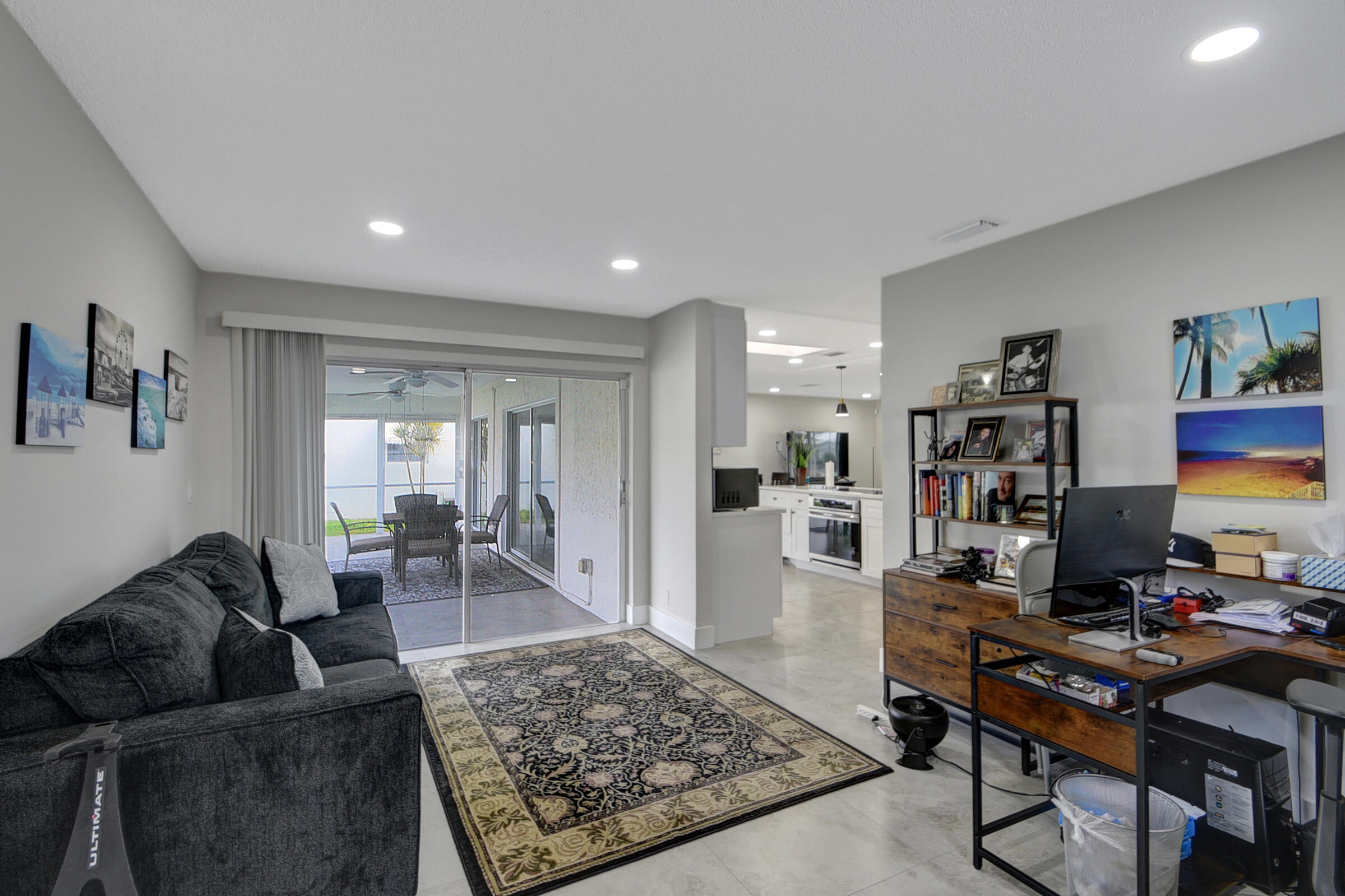 716 Southwest 18th Street Boynton Beach, FL 33426 - Photo 47 of 65 a living room with furniture and a flat screen tv